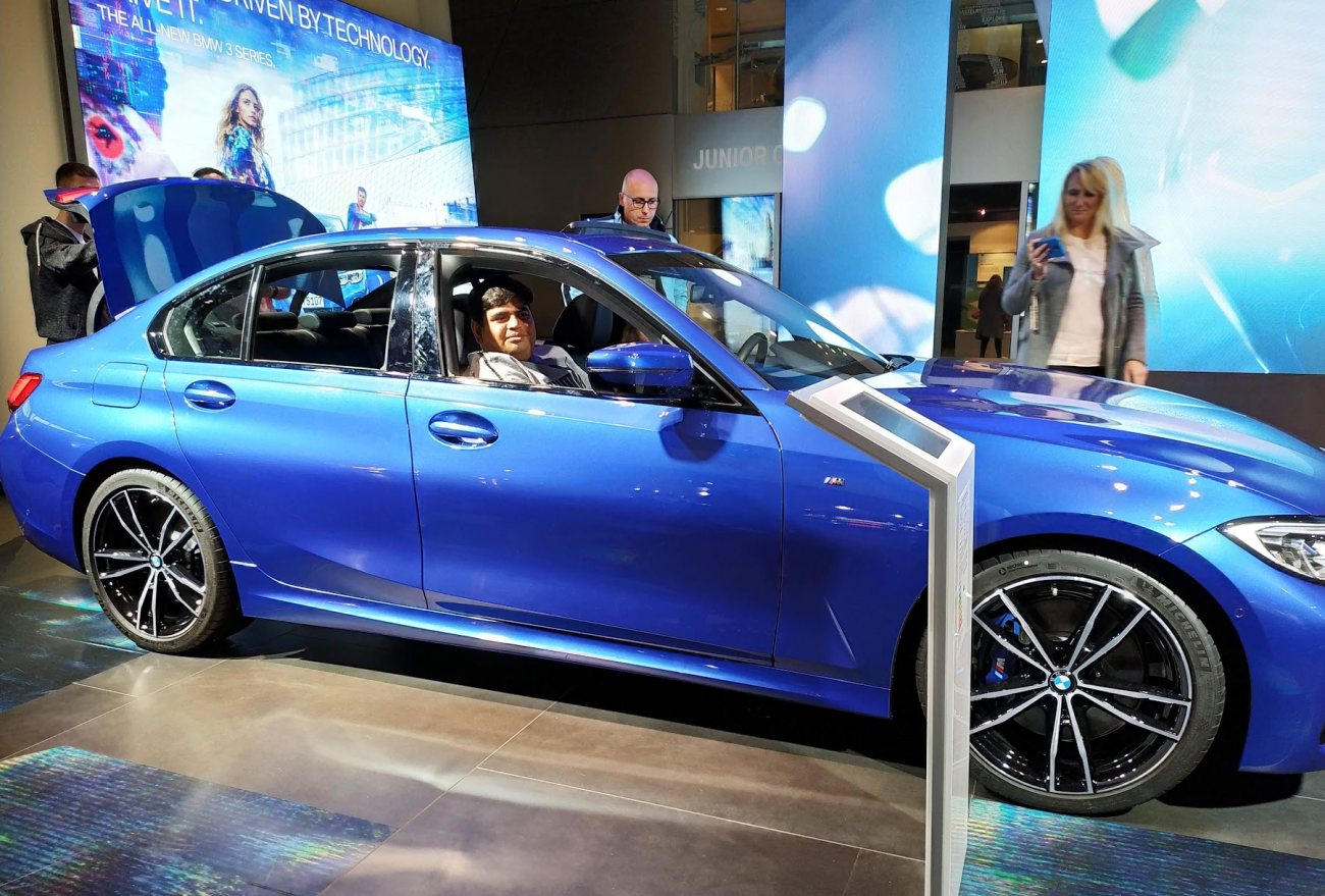Vishwa Ranjan seated in a blue BMW 3 Series