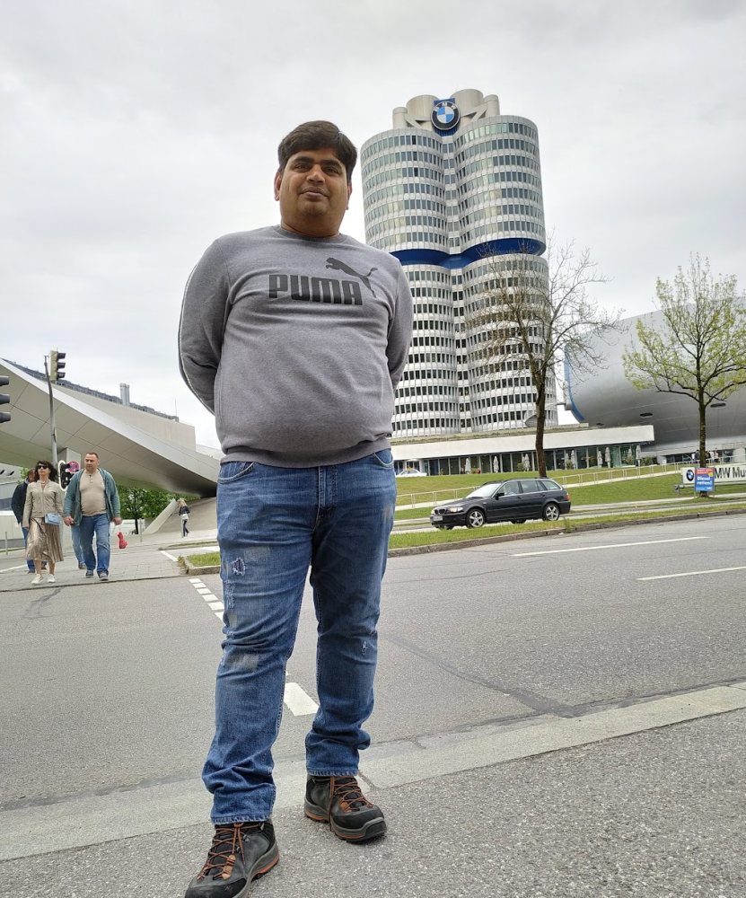 Vishwa Ranjan in front of the BMW four-cylinder headquarters tower in Munich
