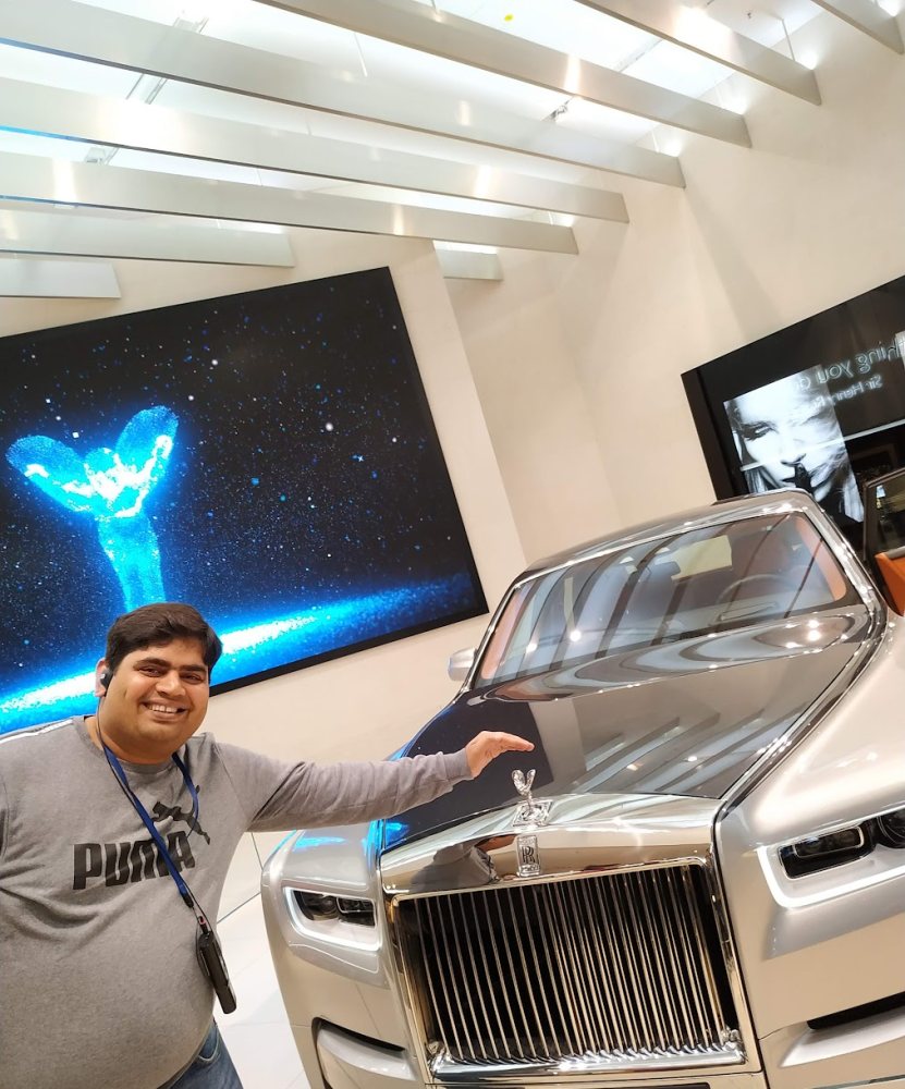 Vishwa Ranjan beside a Rolls-Royce Phantom