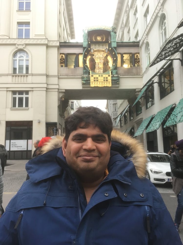 Vishwa Ranjan before the Ankeruhr clock in Vienna